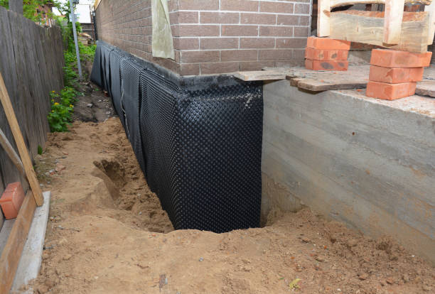 SJ Waterproofing Pros technician performing targeted Exterior Waterproofing assessment in Brighton, MI